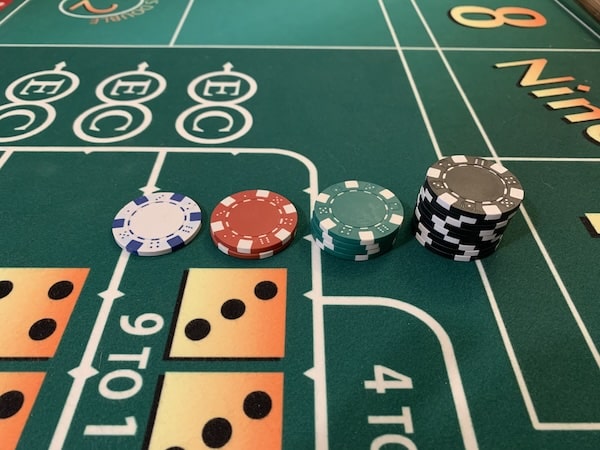 craps table with chips showing parlay bet increments